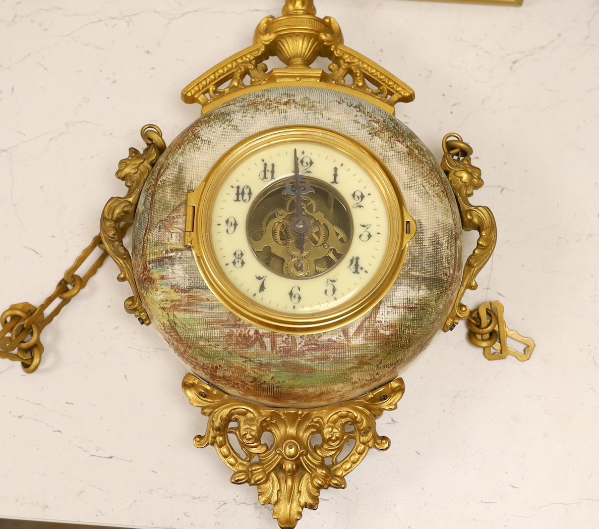 A late 19th century French ornate ceramic and gilt brass wall clock, 35cm tall